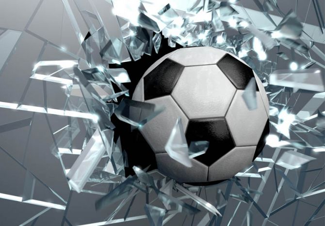 Фотообои Футбольный мяч и битое стекло