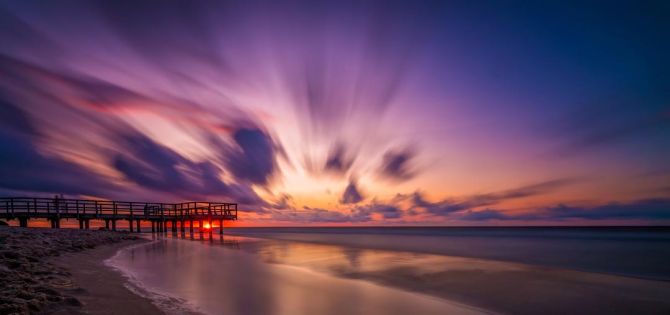Фотошпалери Розмитий захід сонця над морем